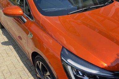 Orange Vauxhall Corsa front windscreen replaced in driveway